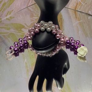 Elegant pearl bracelet with purple, pink, and white pearls with Rhinestones.